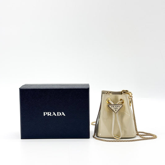 Prada Patent Leather Micro Bucket Bag Beige Gold Hardware