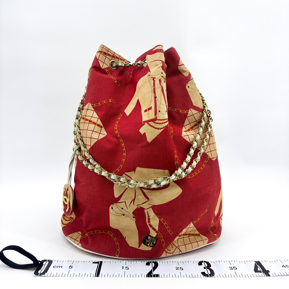 Chanel canvas print chain drawstring bag