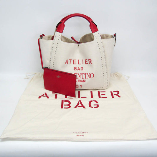 Sac cabas à bandoulière en cuir et toile Valentino Garavani Atelier, rouge et blanc