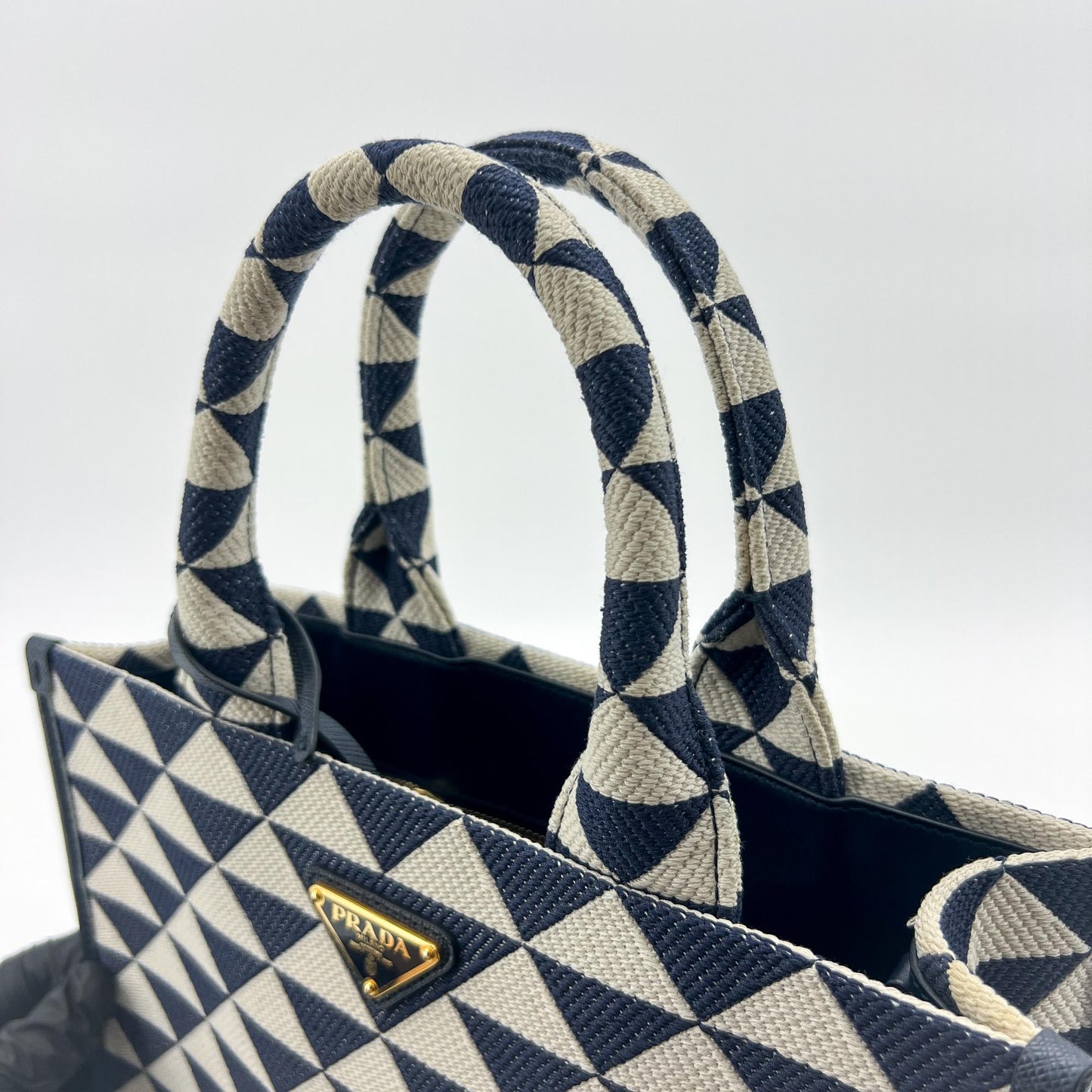 Prada symbol embroidered fabric tote bag