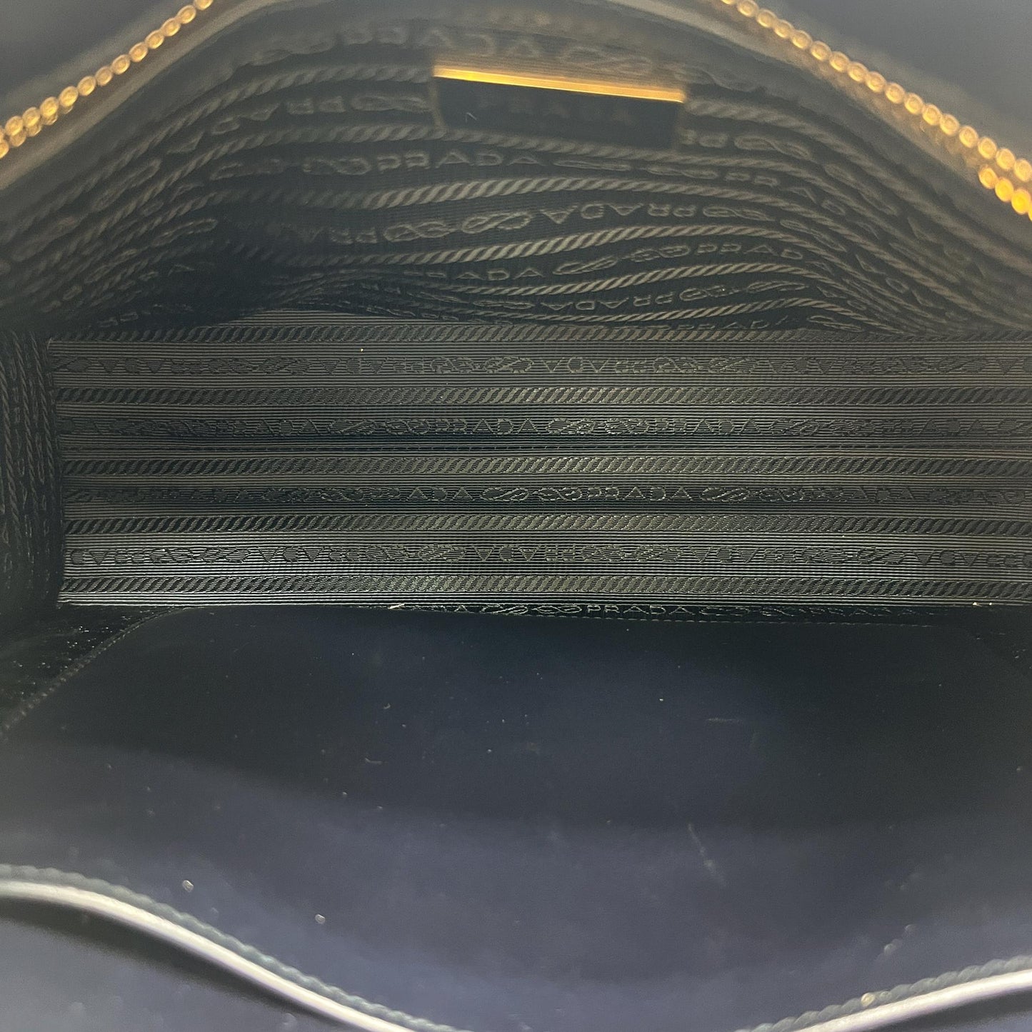Prada symbol embroidered fabric tote bag